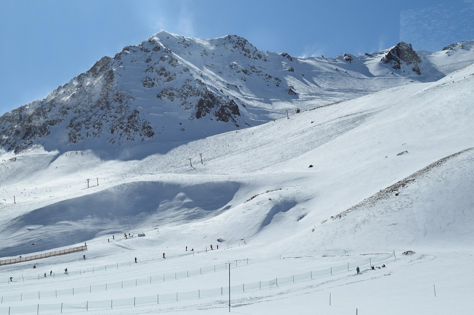 Penitentes village beneath snow-capped peaks