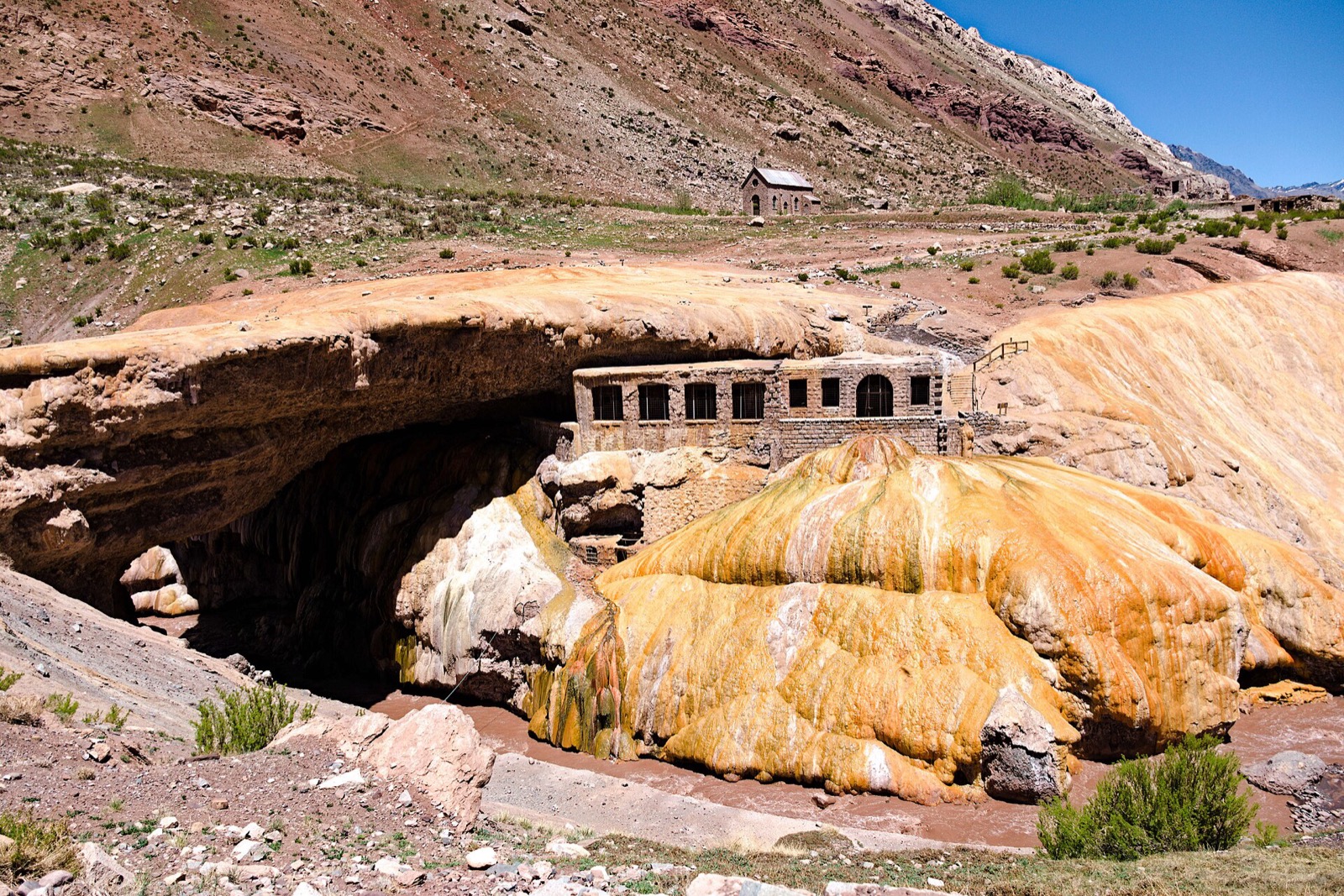 The Puente del Inca natural bridge with its ochre mineral terraces