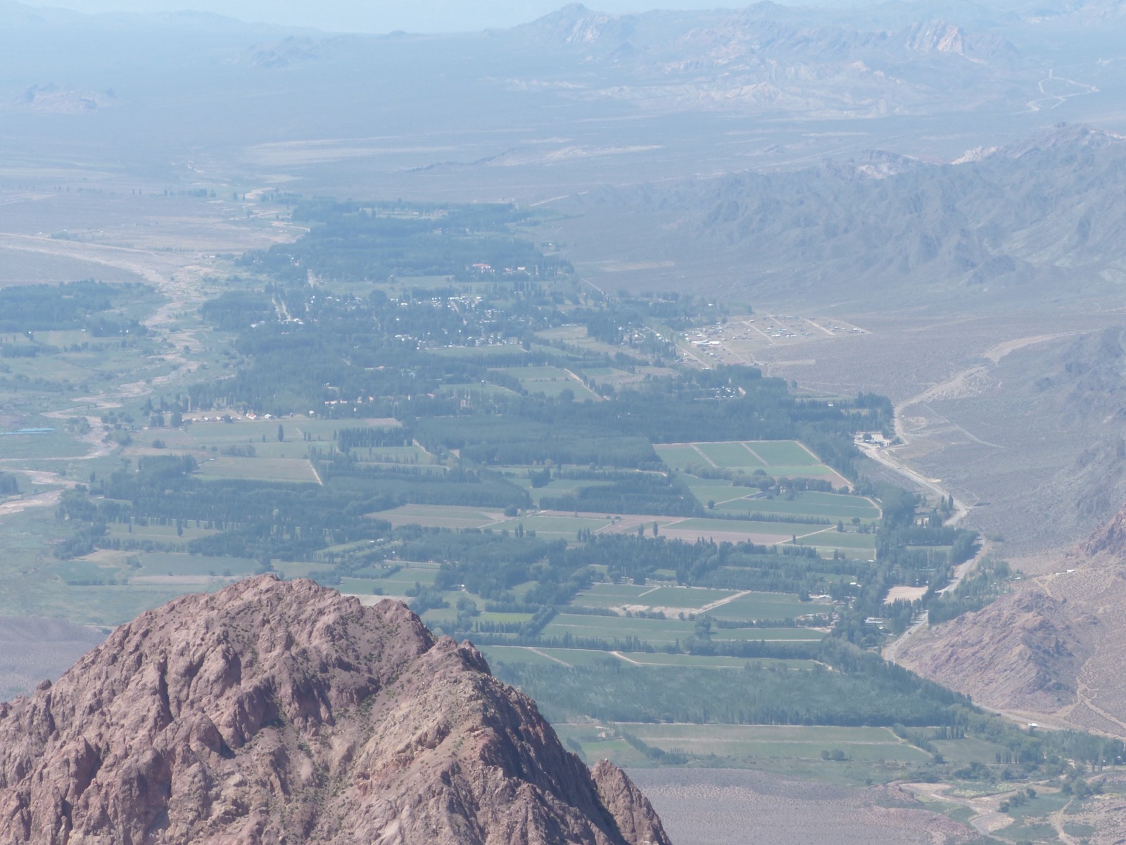 The broad Uspallata valley with coloured ranges behind